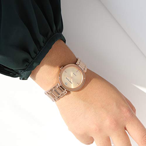 Read more about the article Anne Klein Women’s AK/1362RGRG Rose Gold-Tone Diamond-Accented Bracelet Watch